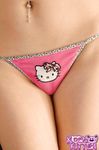Redhead Korina Bliss strips to her hello kitty panties and fishnet kneehighs