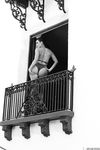 Hypnotizing brunette Sunny Leone in exciting black lingerie on the balcony