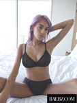 Solo girl Janice Griffith uncovers her firm breasts as she strips to her socks